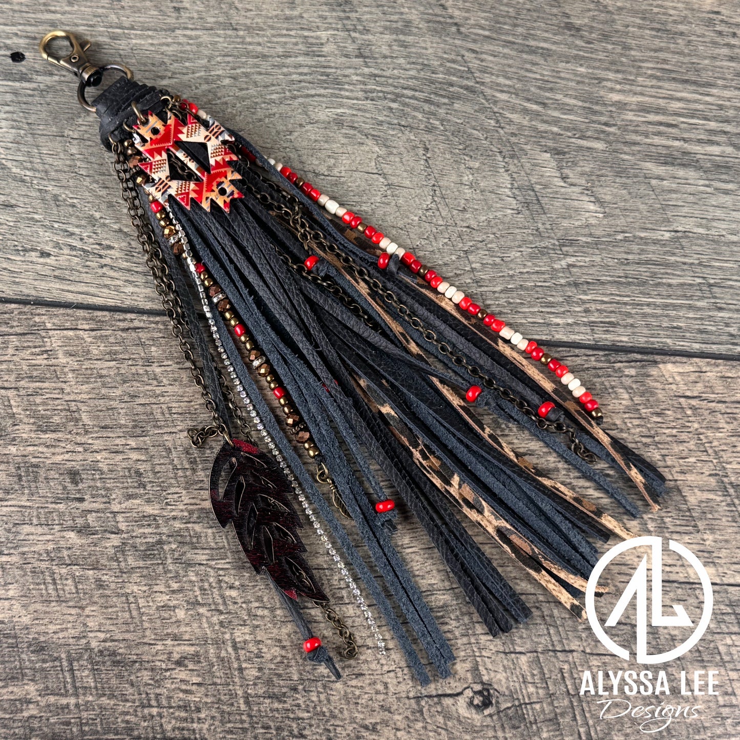 “Junk’d Up” Tassel 003 - Black Fringe w/Red Navajo